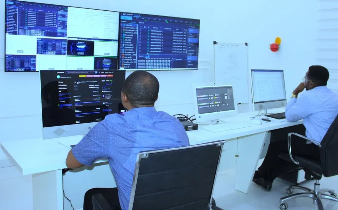 Operators coordinating work at monitoring consoles