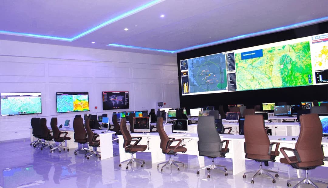 Intelligence operations room with large mapping displays